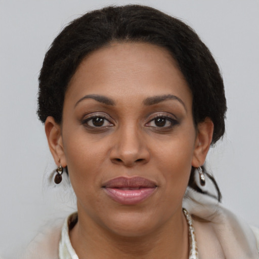 Joyful latino young-adult female with short  brown hair and brown eyes