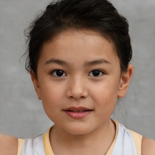 Joyful white child female with short  brown hair and brown eyes