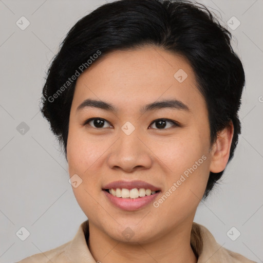 Joyful latino young-adult female with short  brown hair and brown eyes