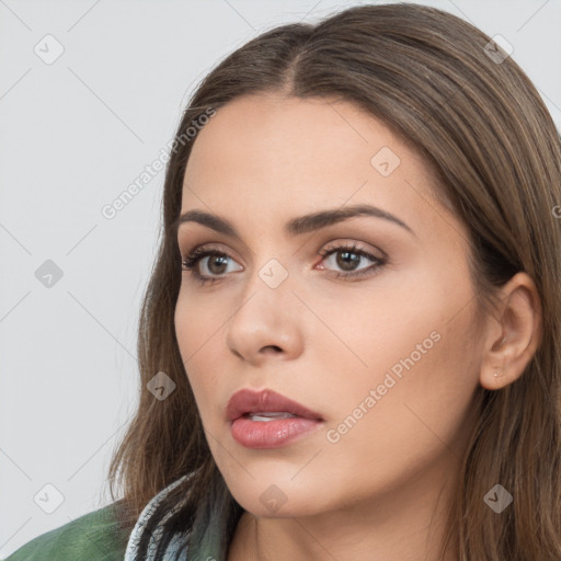 Neutral white young-adult female with long  brown hair and brown eyes