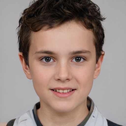 Joyful white child male with short  brown hair and brown eyes