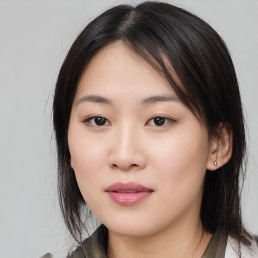 Neutral asian young-adult female with medium  brown hair and brown eyes