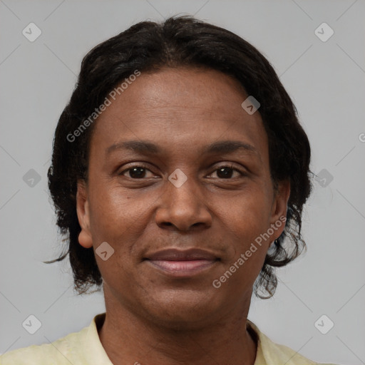 Joyful black adult female with short  brown hair and brown eyes