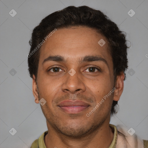 Joyful black adult male with short  brown hair and brown eyes