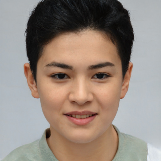 Joyful asian young-adult female with short  brown hair and brown eyes