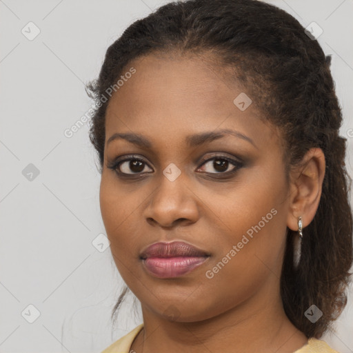 Joyful black young-adult female with medium  brown hair and brown eyes