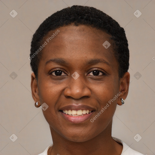 Joyful black young-adult female with short  black hair and brown eyes