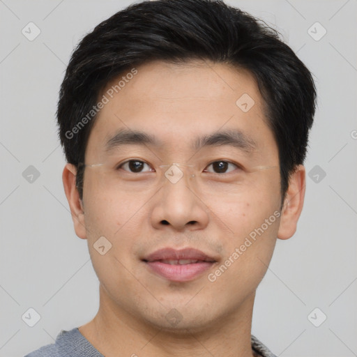 Joyful asian young-adult male with short  black hair and brown eyes