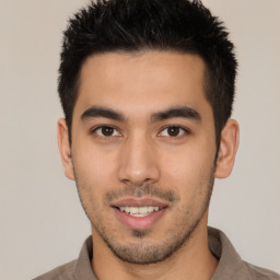 Joyful latino young-adult male with short  brown hair and brown eyes