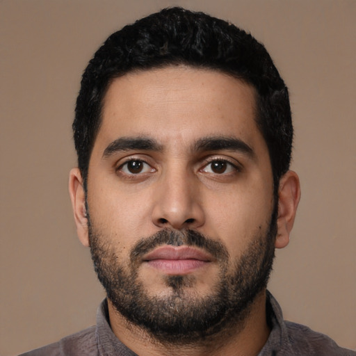 Neutral latino young-adult male with short  black hair and brown eyes