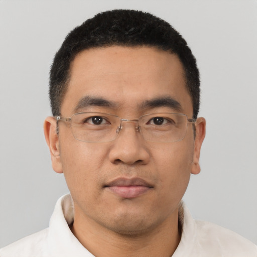 Neutral latino adult male with short  black hair and brown eyes