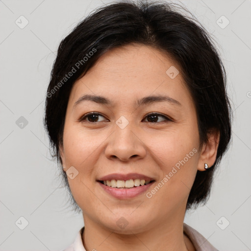 Joyful white adult female with medium  brown hair and brown eyes