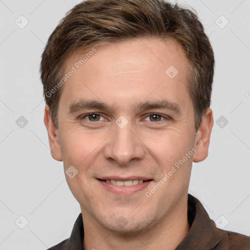 Joyful white young-adult male with short  brown hair and grey eyes