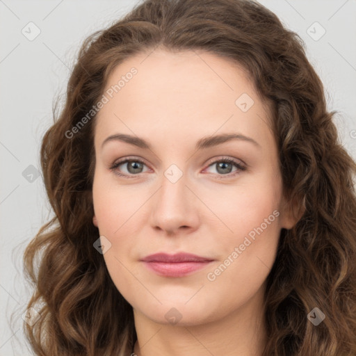 Joyful white young-adult female with long  brown hair and green eyes