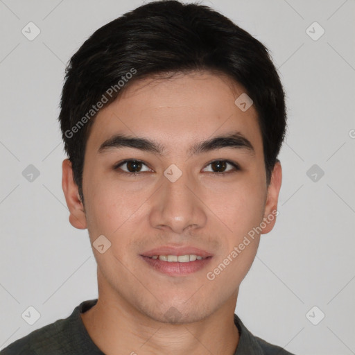 Joyful asian young-adult male with short  brown hair and brown eyes