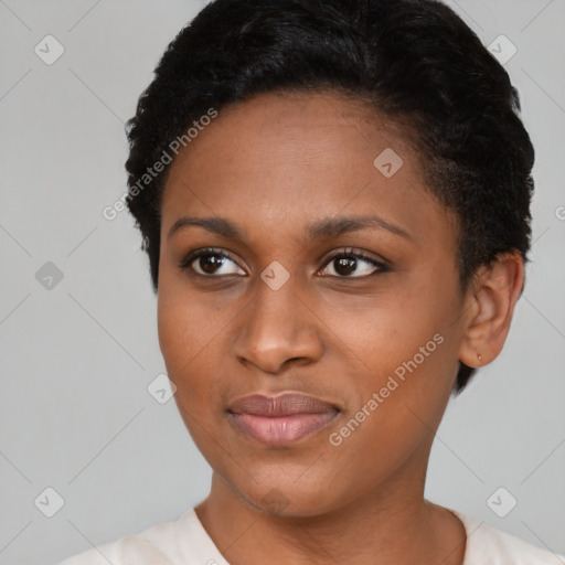 Joyful black young-adult female with short  black hair and brown eyes