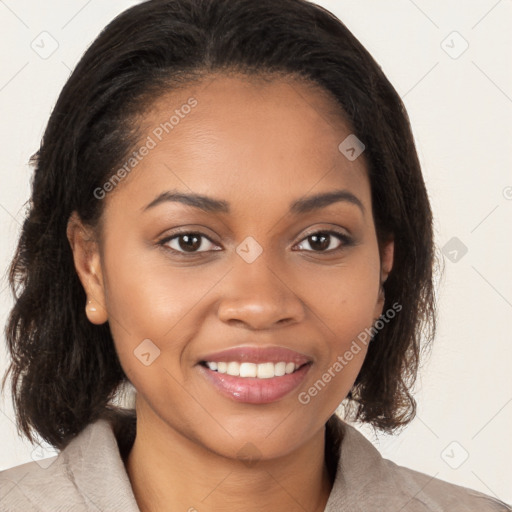 Joyful black young-adult female with medium  brown hair and brown eyes