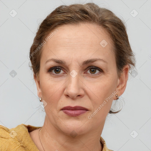 Joyful white adult female with short  brown hair and brown eyes