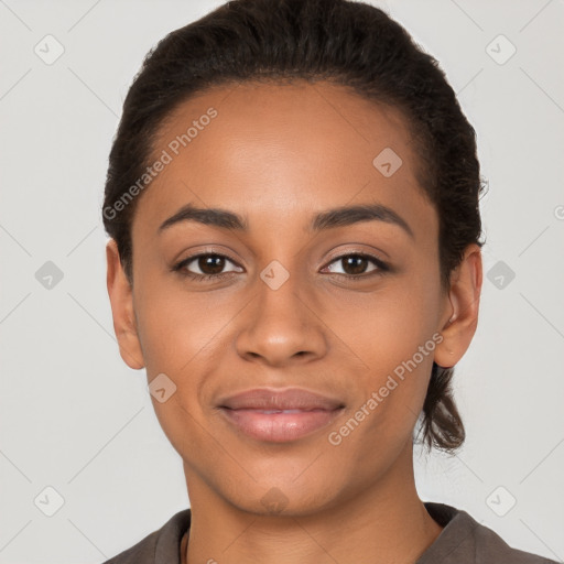 Joyful latino young-adult female with short  brown hair and brown eyes