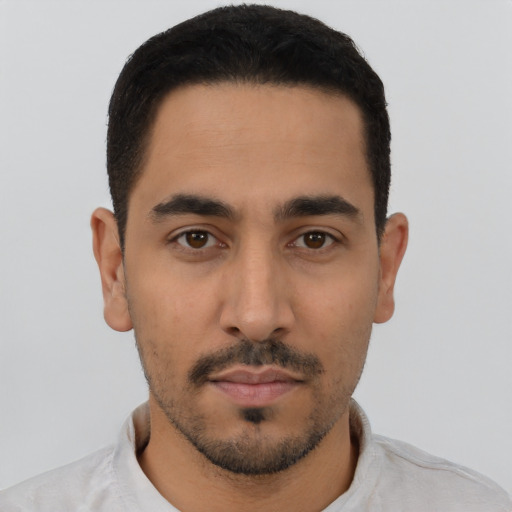 Neutral latino young-adult male with short  black hair and brown eyes