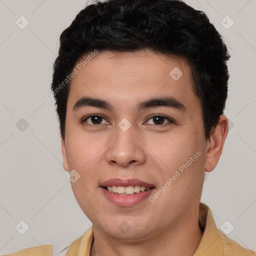 Joyful asian young-adult male with short  brown hair and brown eyes