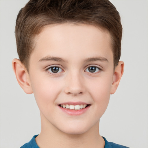 Joyful white child male with short  brown hair and brown eyes