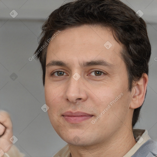 Joyful white adult male with short  brown hair and brown eyes