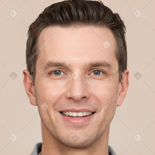 Joyful white adult male with short  brown hair and grey eyes