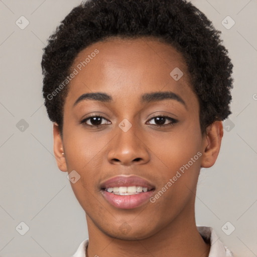 Joyful black young-adult female with short  brown hair and brown eyes