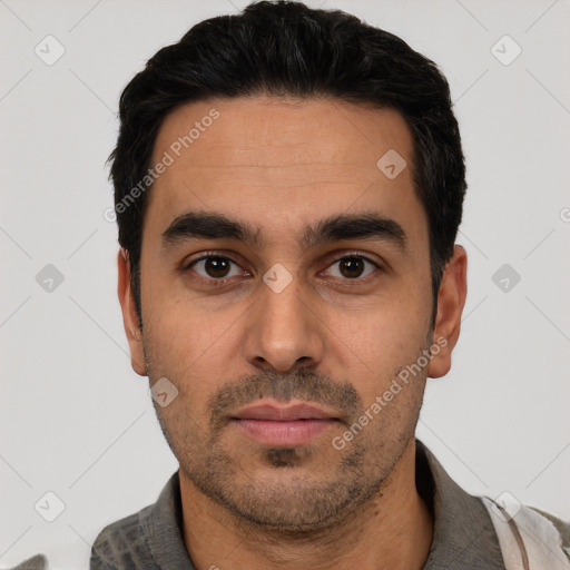 Neutral white young-adult male with short  black hair and brown eyes