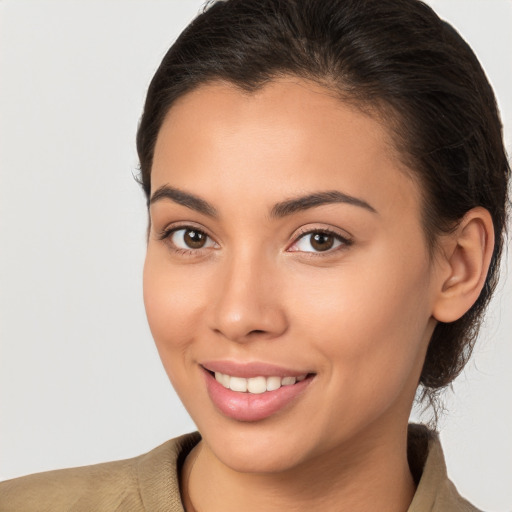 Joyful white young-adult female with long  brown hair and brown eyes