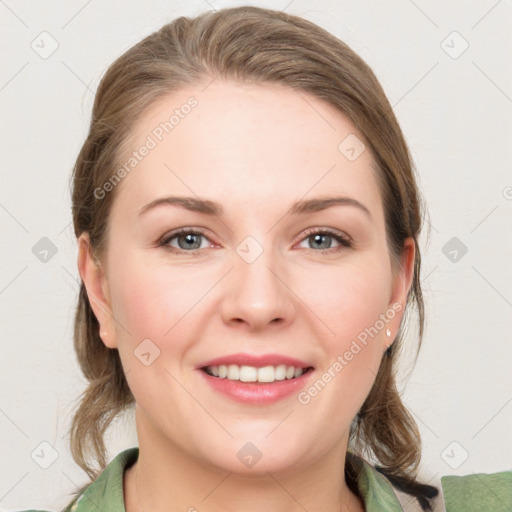 Joyful white young-adult female with medium  brown hair and grey eyes