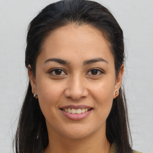 Joyful white young-adult female with long  brown hair and brown eyes
