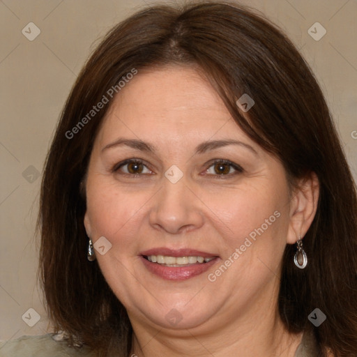 Joyful white adult female with medium  brown hair and brown eyes