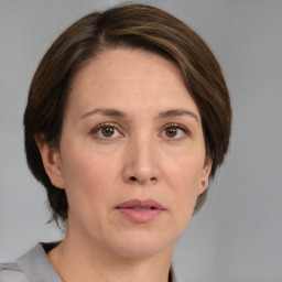 Neutral white adult female with medium  brown hair and grey eyes