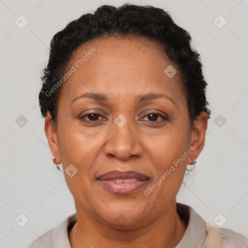Joyful latino adult female with short  brown hair and brown eyes