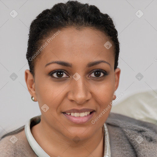 Joyful black young-adult female with short  brown hair and brown eyes