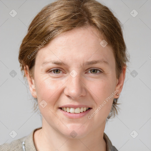 Joyful white adult female with medium  brown hair and grey eyes