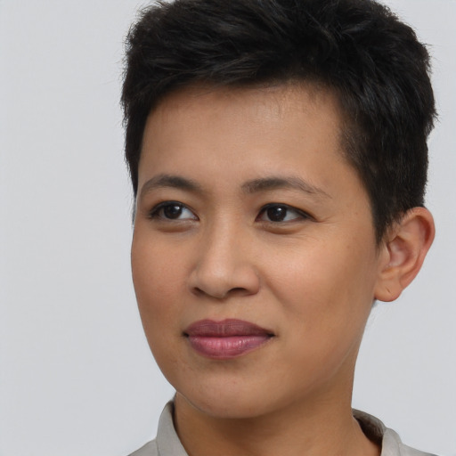 Joyful asian young-adult female with short  brown hair and brown eyes