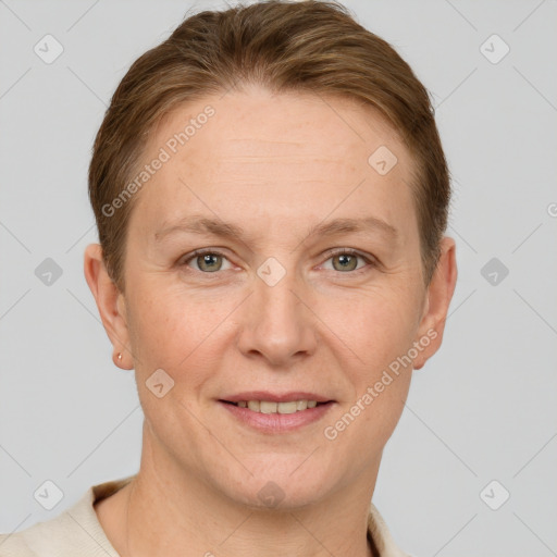 Joyful white adult female with short  brown hair and grey eyes