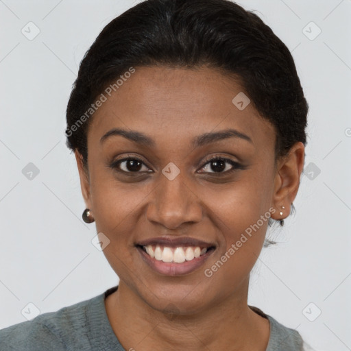 Joyful black young-adult female with short  brown hair and brown eyes