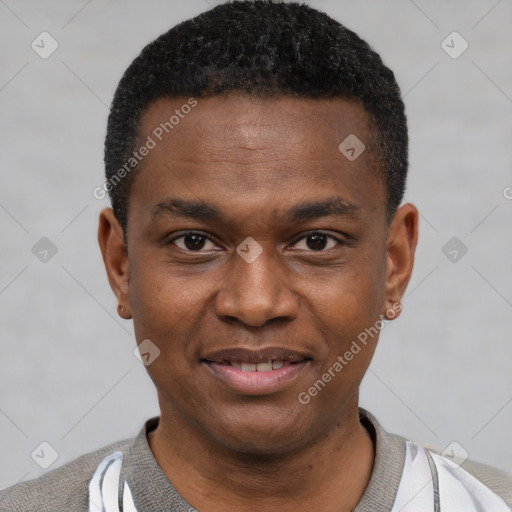 Joyful black young-adult male with short  black hair and brown eyes