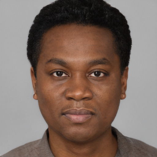 Neutral black young-adult male with short  black hair and brown eyes