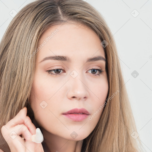 Neutral white young-adult female with long  brown hair and brown eyes