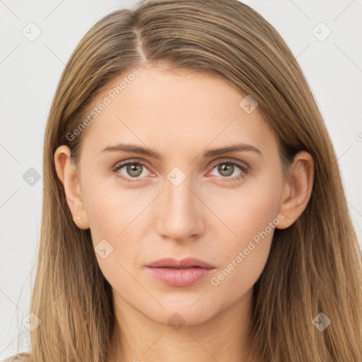 Neutral white young-adult female with long  brown hair and brown eyes