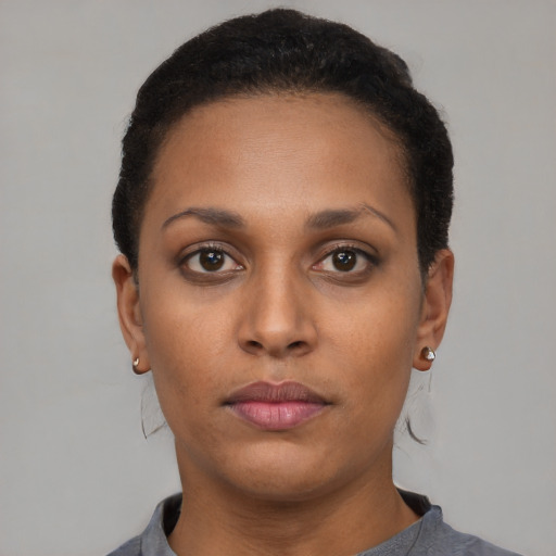 Neutral latino young-adult female with short  black hair and brown eyes