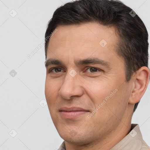 Joyful white adult male with short  brown hair and brown eyes