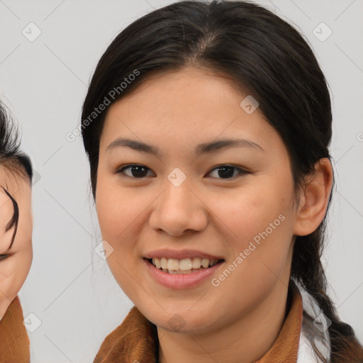 Joyful asian young-adult female with medium  brown hair and brown eyes