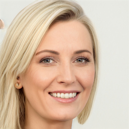 Joyful white young-adult female with long  blond hair and blue eyes