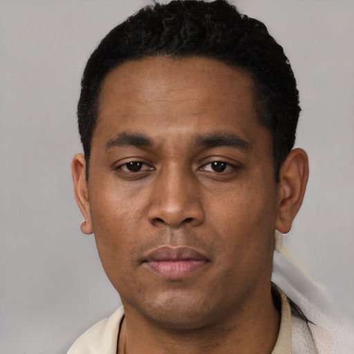 Neutral latino young-adult male with short  black hair and brown eyes